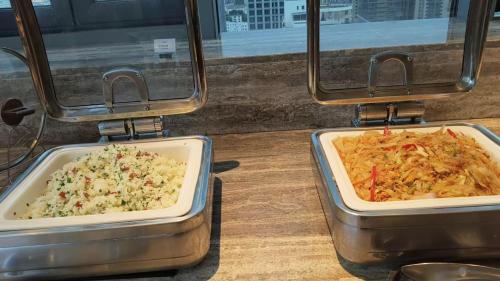two trays of food sitting on top of a table at Mercure Suzhou Shilu Shantang in Suzhou