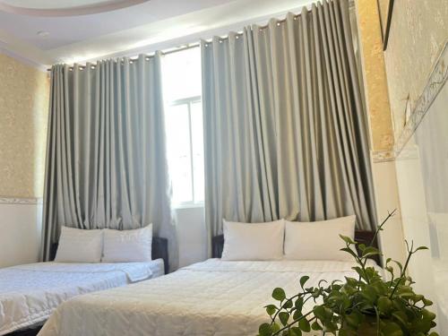 Giường trong phòng chung tại My Kim Hotel - Ngay Bến Ninh Kiều