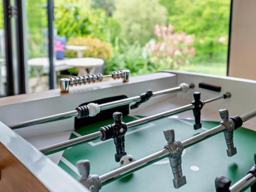 a row of metal bars on top of a table at 5 Bed in Exebridge 41133 in Brushford