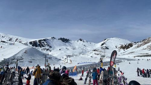 a group of people on a snow covered ski slope at Queenstown Retreat in Queenstown