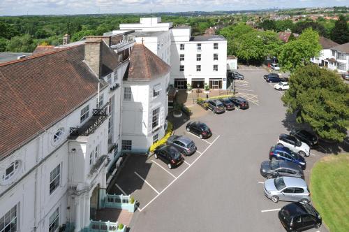an aerial view of a parking lot next to a building at Bromley Court Hotel London in Bromley