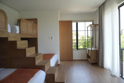 Ένα ή περισσότερα κρεβάτια σε δωμάτιο στο TwelveStones Pecatu-Uluwatu Pool, Jacuzzi&Beaches