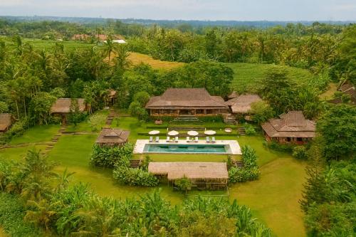 an aerial view of a resort with a swimming pool at Barefoot in the Heart in Krambitan