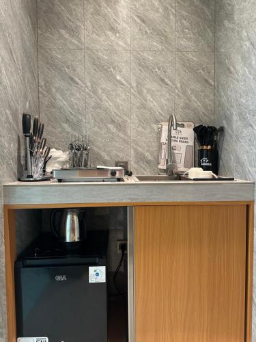 a kitchen with a counter top with a sink and a counter at Pondok Metis in Tumbak Bayuh