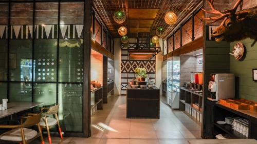 a restaurant with a cow head on the wall at Sugar Marina Hotel CLIFFHANGER Aonang in Ao Nang Beach