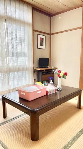 a table with two boxes on top of it at 苗場ウッドインだいまる in Yuzawa