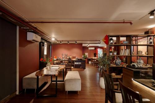 a restaurant with a dining room with tables and chairs at Asian Ruby Hotel & Spa - 122F Bui Thi Xuân Street in Ho Chi Minh City