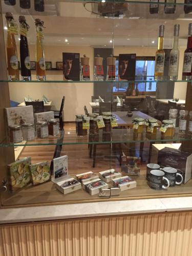 a display case in a store filled with lots of food at Hotel Gasthof Käßer in Ansbach