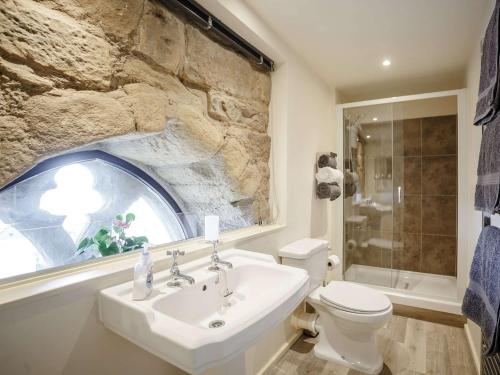 a bathroom with a sink and a toilet and a window at 1 bed property in Alnwick 82212 in Alnwick