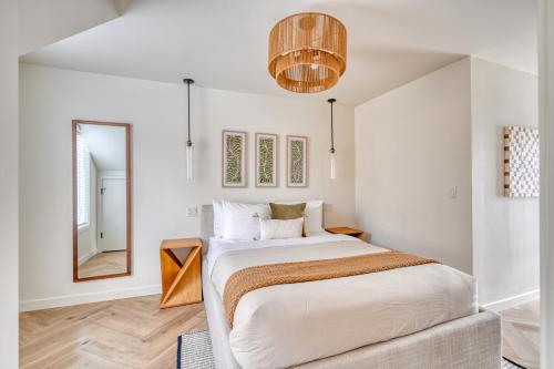 a bedroom with a large bed and a mirror at Stay Portland - Alberta Arts-tastic Mother-In-Law Suite in Portland