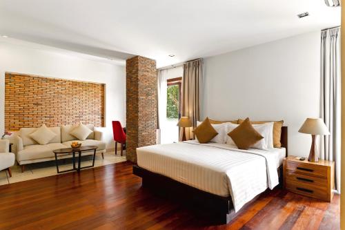 Postel nebo postele na pokoji v ubytování Nita By Vo Luxury Hotel