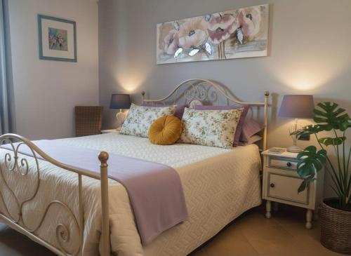 a bedroom with a white bed with a pumpkin on it at La Casa Di Stefania in Pollutri