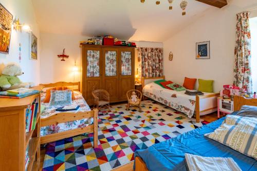 a room with a bedroom with a bed and a room with at Gîte Les Ailliers in La Chaudière