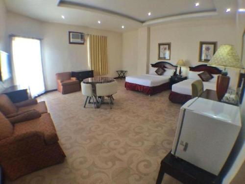 Postel nebo postele na pokoji v ubytování Cindy Kelly Hotel