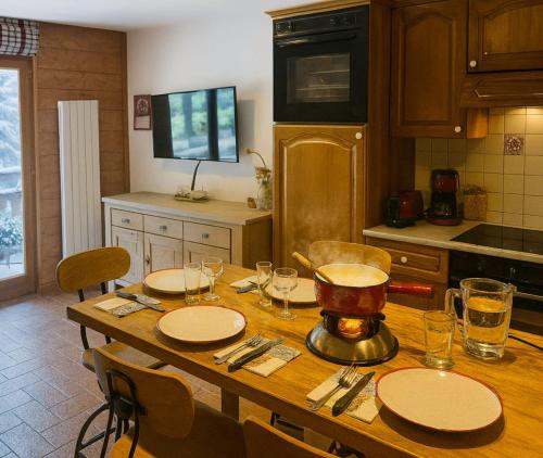 a kitchen with a table with a blender on it at Alpine Cocoon at 5 min On foot from the cable car in Les Houches