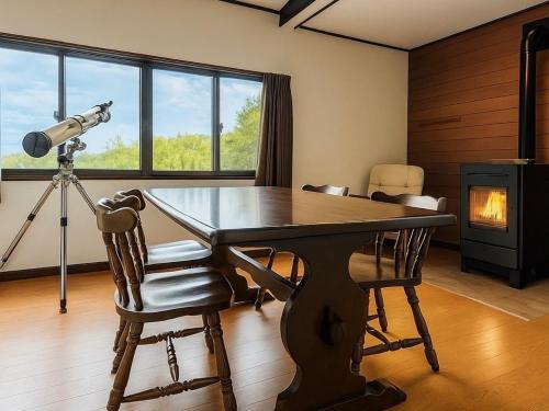 a room with a table and a camera and a telescope at THE LOOKOUT KUSATSU - Vacation STAY 90962v in Kusatsu