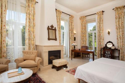 a bedroom with a bed and a fireplace at Casa de los Bates in Motril