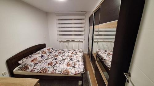 Ένα ή περισσότερα κρεβάτια σε δωμάτιο στο Apartman Sunce