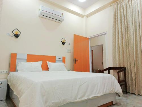 Ένα ή περισσότερα κρεβάτια σε δωμάτιο στο Hotel Vista Inn