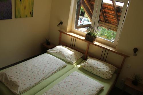 a bedroom with two beds in front of a window at Apartments Luisenhof in Krefeld