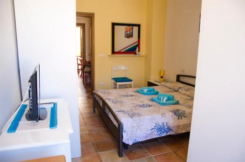 Cama o camas de una habitación en B&B Nonna Sini