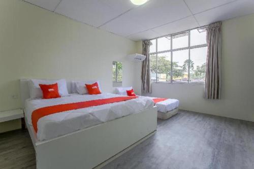 OYO 822 Zande Motel Kuala Selangorにあるベッド