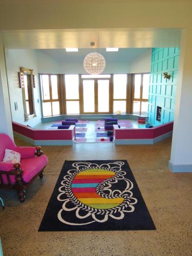 a large room with chairs and a rug on the floor at Lus Mor in Roundwood