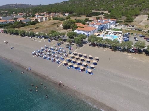 an aerial view of a beach with umbrellas at Aphrodite Beach Hotel in Vatera