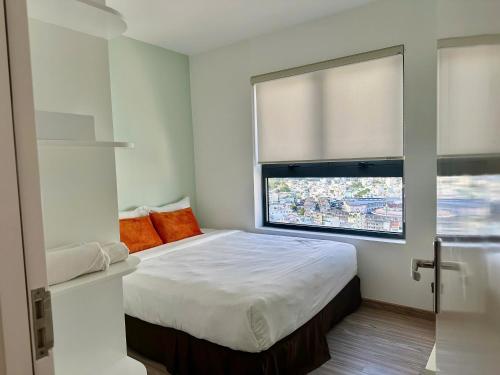 Ένα ή περισσότερα κρεβάτια σε δωμάτιο στο D'Qua Apartment in Nha Trang by HD