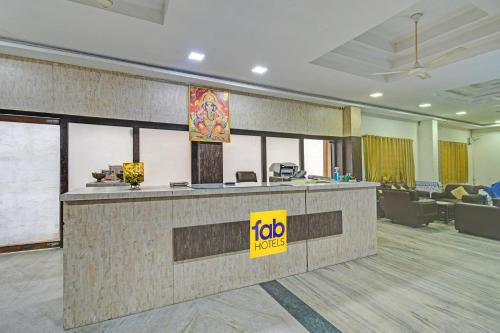 an office with a reception desk in a lobby at FabHotel Ranjit Residency in Hyderabad