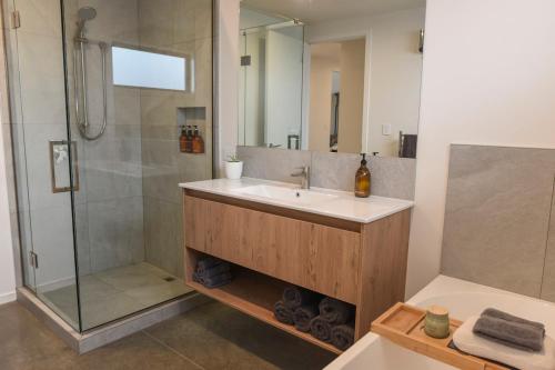 a bathroom with a sink and a shower at A newly built 3 bedroom home in Methven