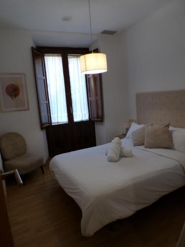 Postel nebo postele na pokoji v ubytování Santiago 30, 1A