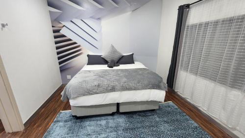 En eller flere senge i et værelse på Casa lux boutique guest house