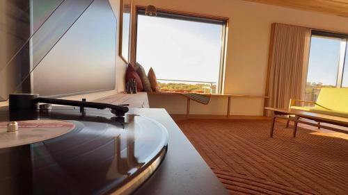 a large room with a large window and a table at Sommerhus Danish inspired beach front retreat in Vivonne Bay