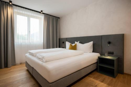 Postel nebo postele na pokoji v ubytování milu Apartments - Fiss