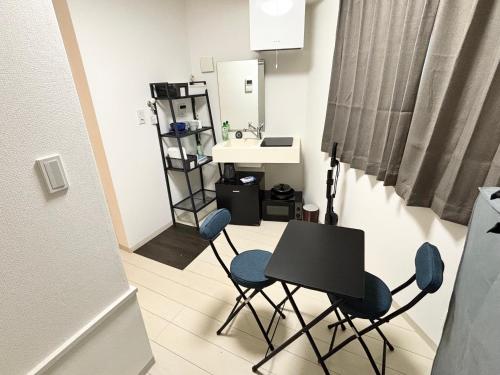a room with a table and chairs and a sink at #45#46 2-factor authentication Shinjuku in Tokyo