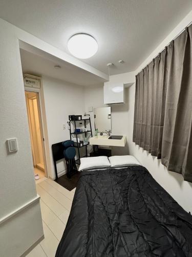 a bedroom with a large bed in a room at #45#46 2-factor authentication Shinjuku in Tokyo
