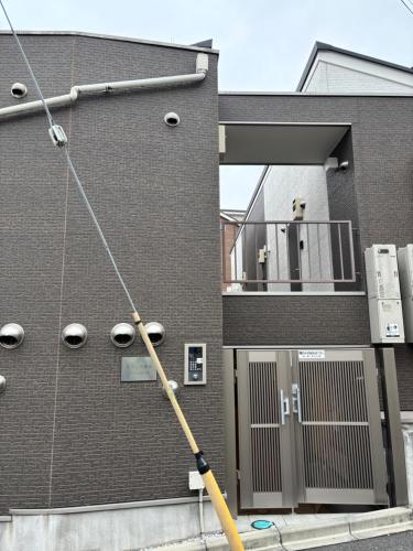 a building with a pole in front of a building at #45#46 2-factor authentication Shinjuku in Tokyo