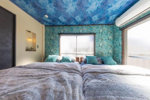 Ένα ή περισσότερα κρεβάτια σε δωμάτιο στο Japanese Modern Great Access Shinjuku 4Bed