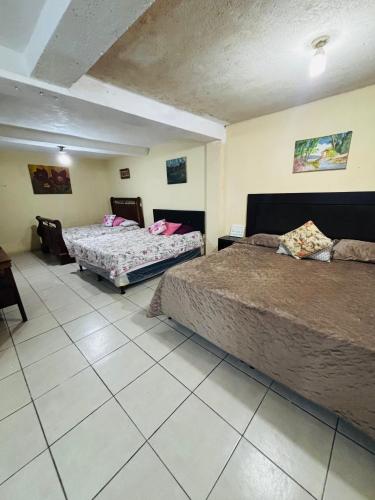 Postel nebo postele na pokoji v ubytování Arianas Place 1