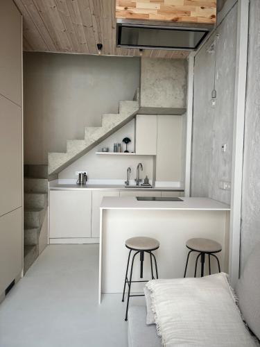 Kuchyň nebo kuchyňský kout v ubytování Designer studio