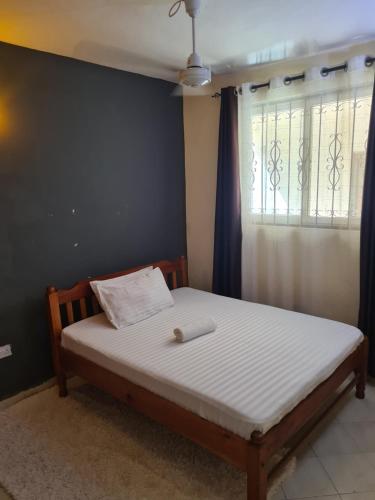 Postel nebo postele na pokoji v ubytování Dee Apartment