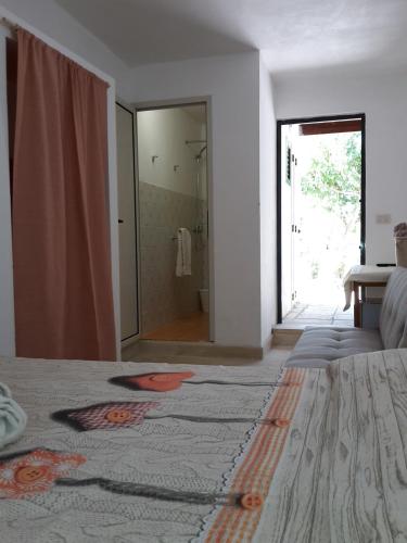a bedroom with a bed with a large mirror at Agriturismo Vignavecchia in Vignacastrisi