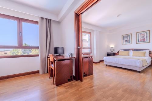 Postel nebo postele na pokoji v ubytování Hotel ITC Ciudad de Haro