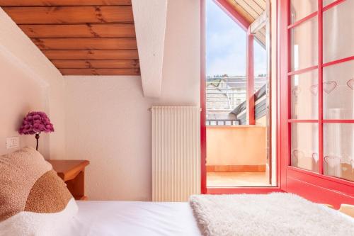 a bedroom with a bed and a large window at Macrillo Guest House in Gallio