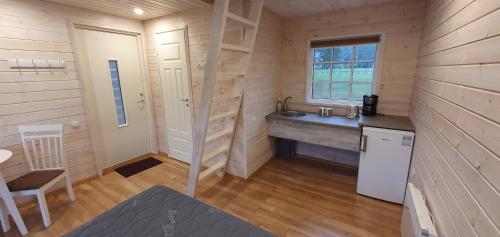 a small bathroom with a sink and a counter at Tuksi Health and Sports Centre in Tuksi