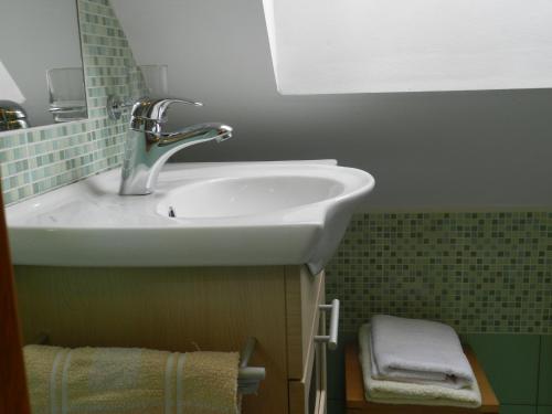Kylpyhuone majoituspaikassa Apartments Dvor