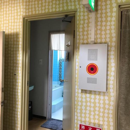 a bathroom with a door open to a bathroom with a tub at Togawa Nojuku - Vacation STAY 49387v in Tuyama