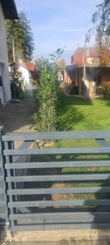 a bench sitting in front of a house at St Georgen im Attergau ein Zimmer Wohnung in Sankt Georgen im Attergau