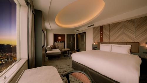 Postel nebo postele na pokoji v ubytování Sapporo Prince Hotel